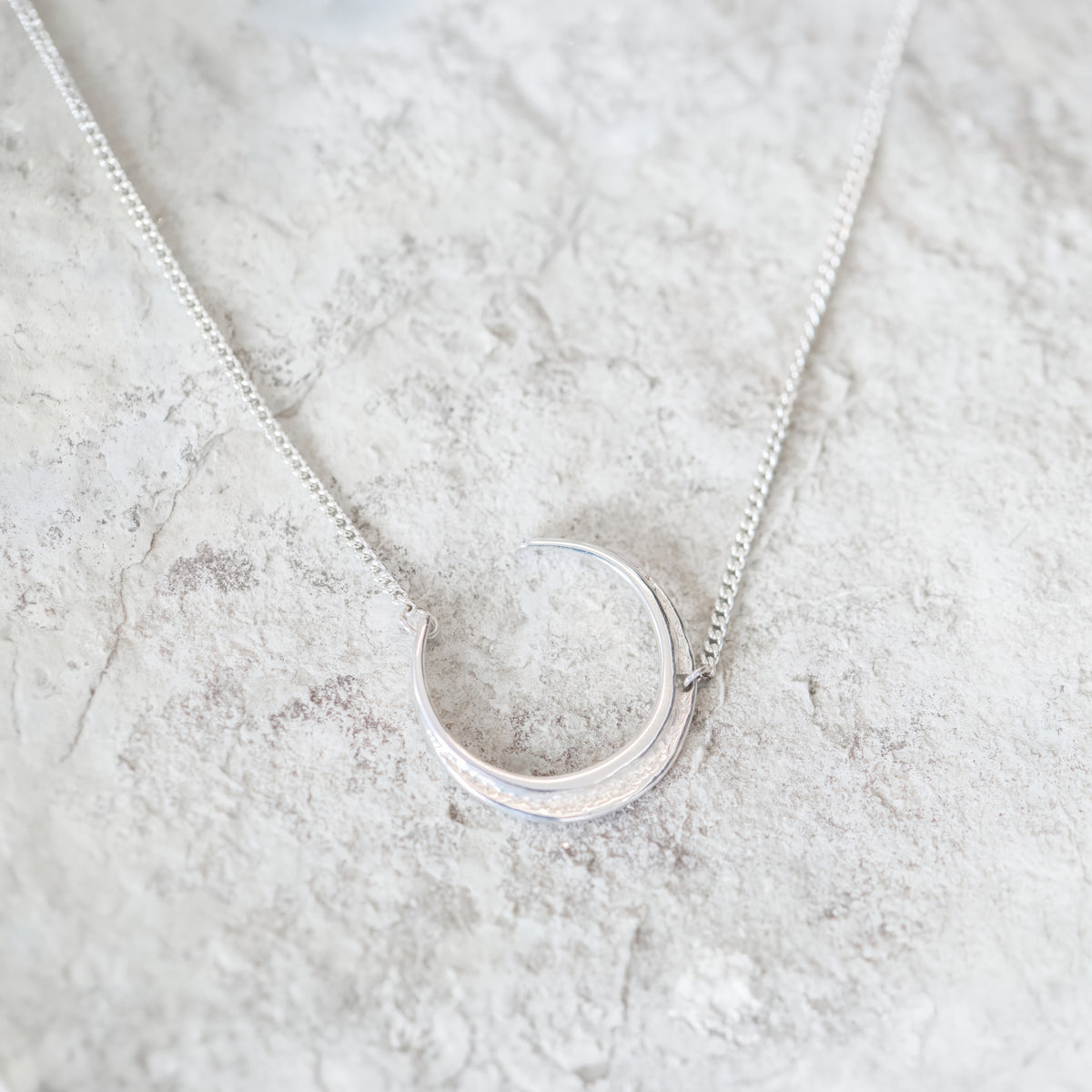 Silver Escarpment Crescent Necklace