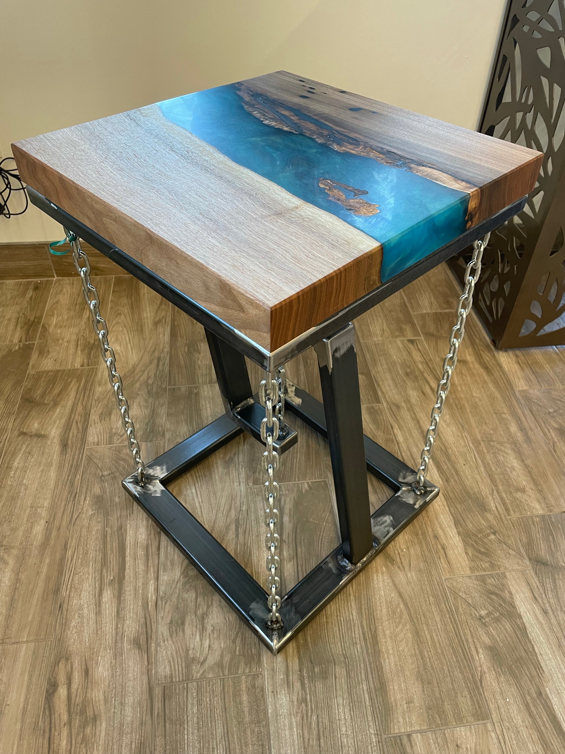 wooden tensegrity table with steel base and chains